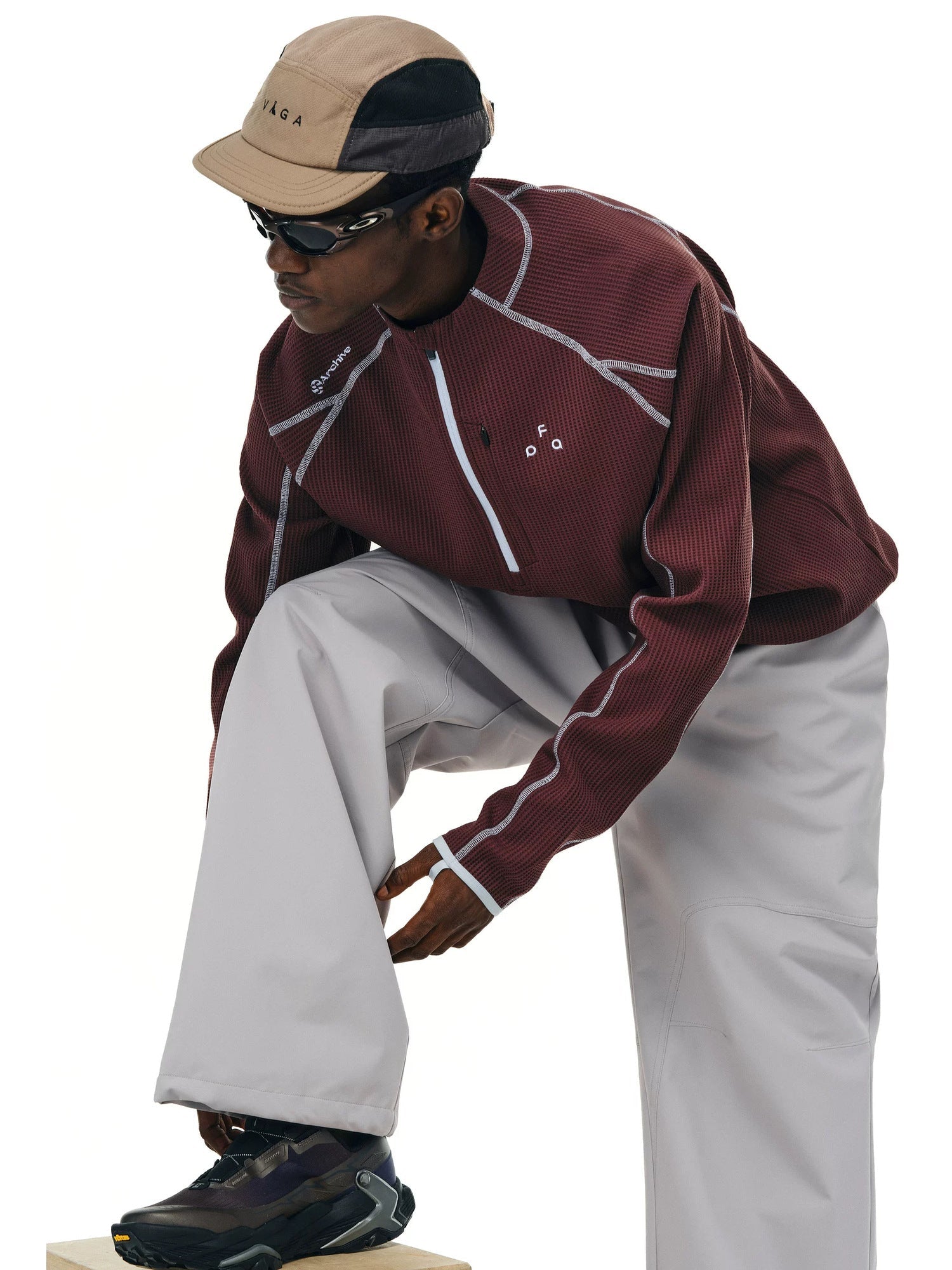 FPA UPF 50+ quick-dry half-zip long-sleeve top in Burgundy Red, seated three quarter